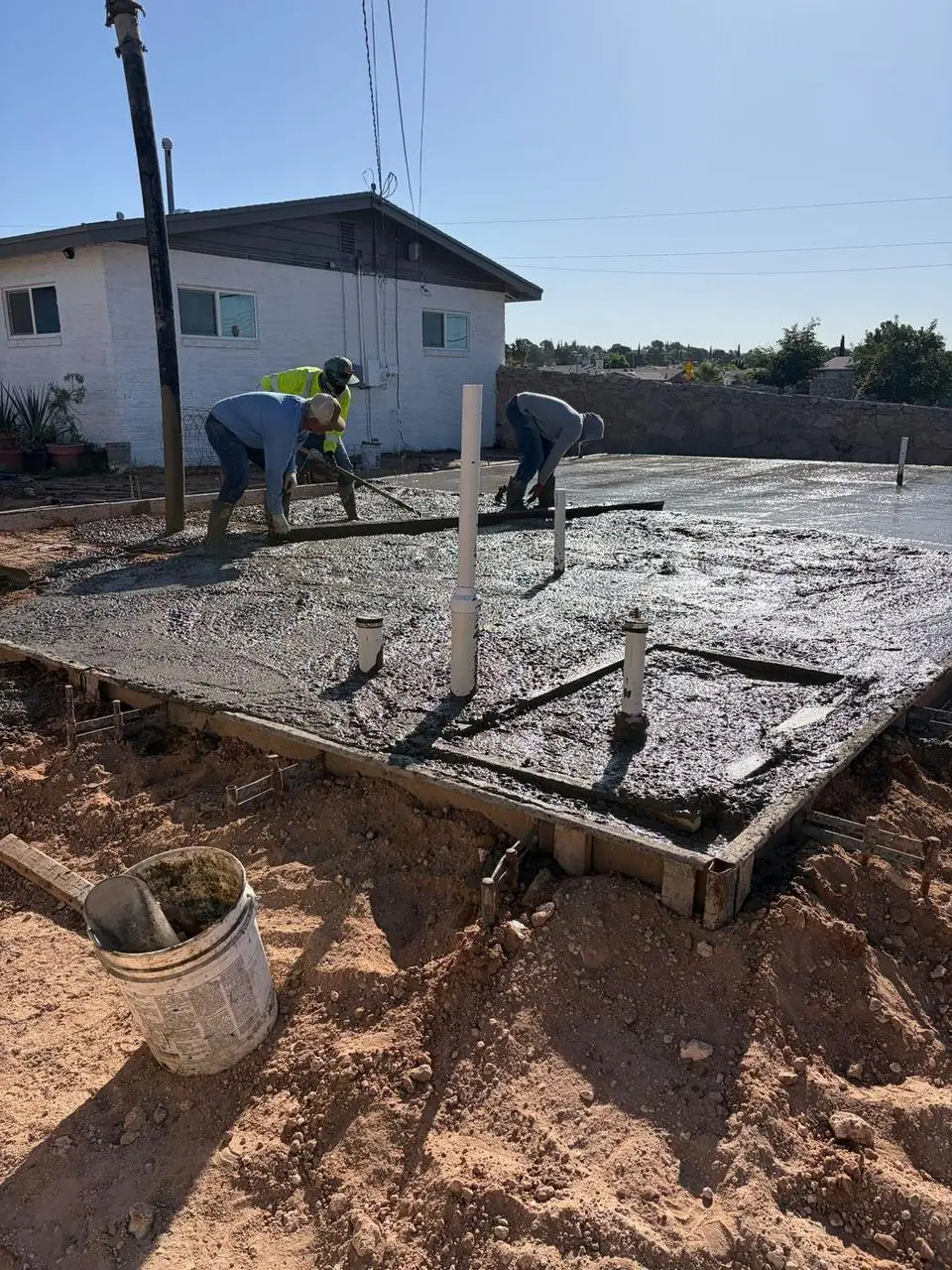 Fuenco crew pouring concrete